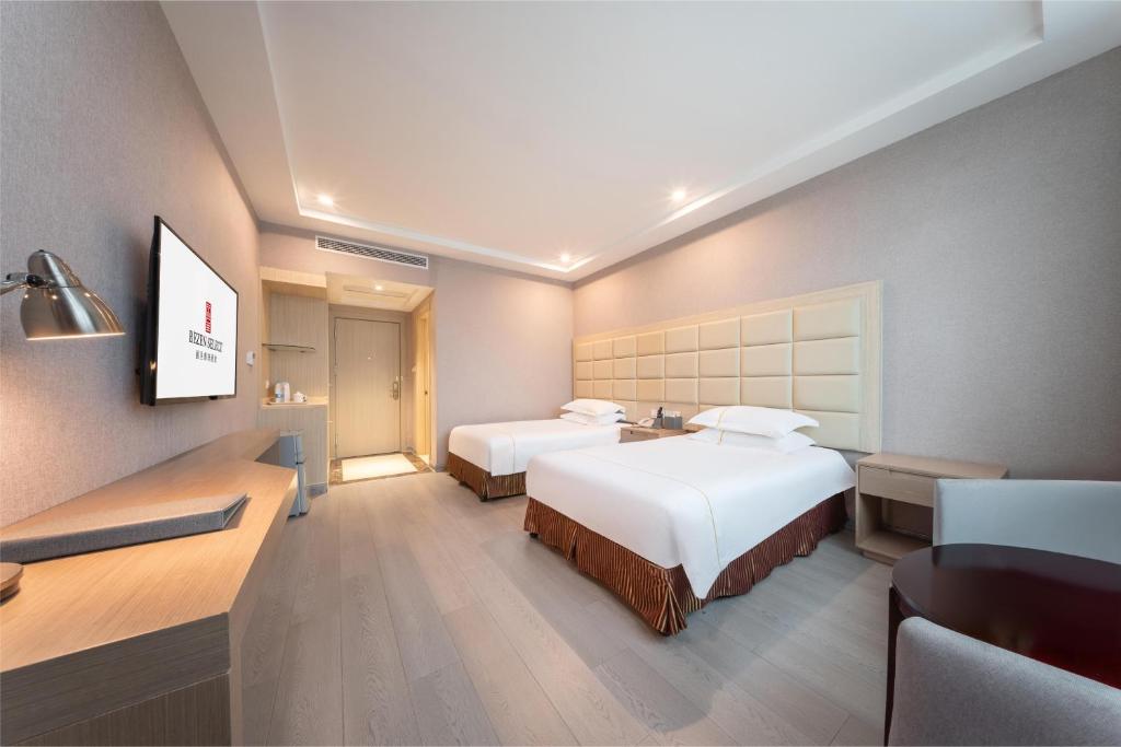 Postel nebo postele na pokoji v ubytování Rezen Select Shanghai International Resort