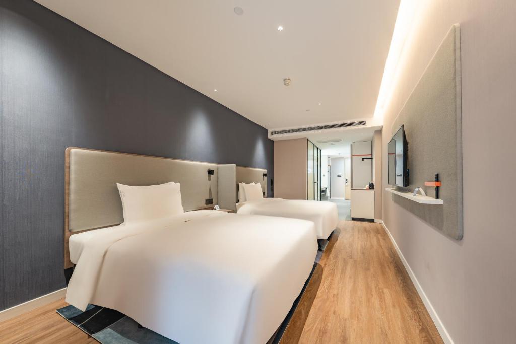 Postel nebo postele na pokoji v ubytování Holiday Inn Express Shanghai Expo Centre by IHG