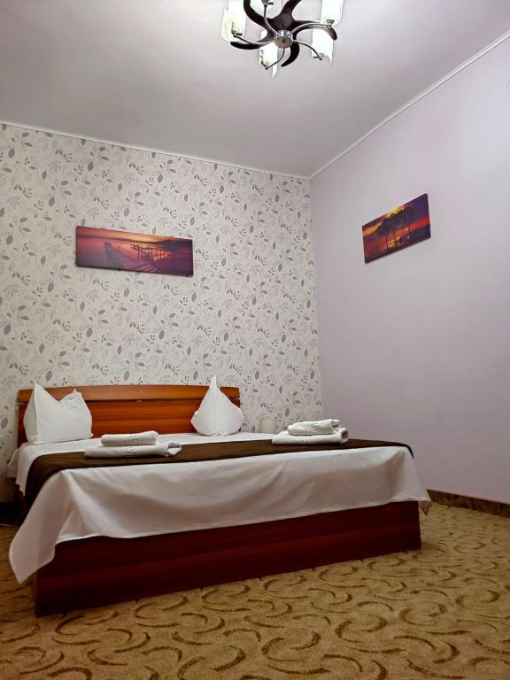 Postel nebo postele na pokoji v ubytování Hotel Triumph