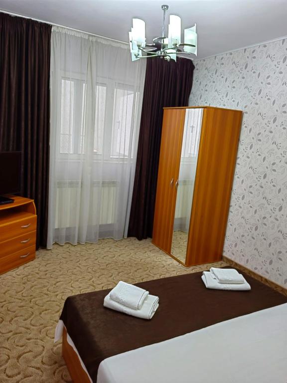 Postel nebo postele na pokoji v ubytování Hotel Triumph