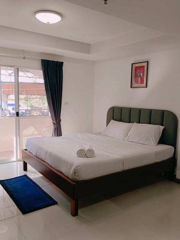 Postel nebo postele na pokoji v ubytování Convenient Resort