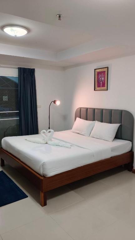 Postel nebo postele na pokoji v ubytování Convenient Resort