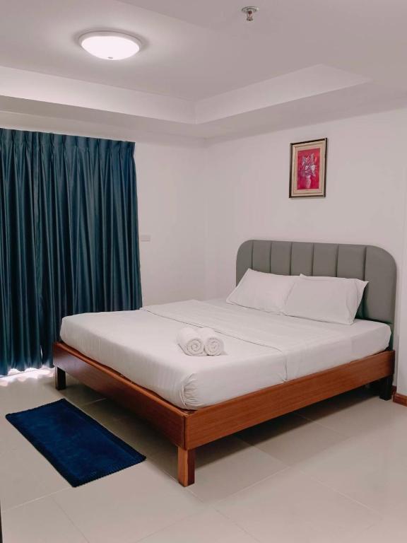 Postel nebo postele na pokoji v ubytování Convenient Resort