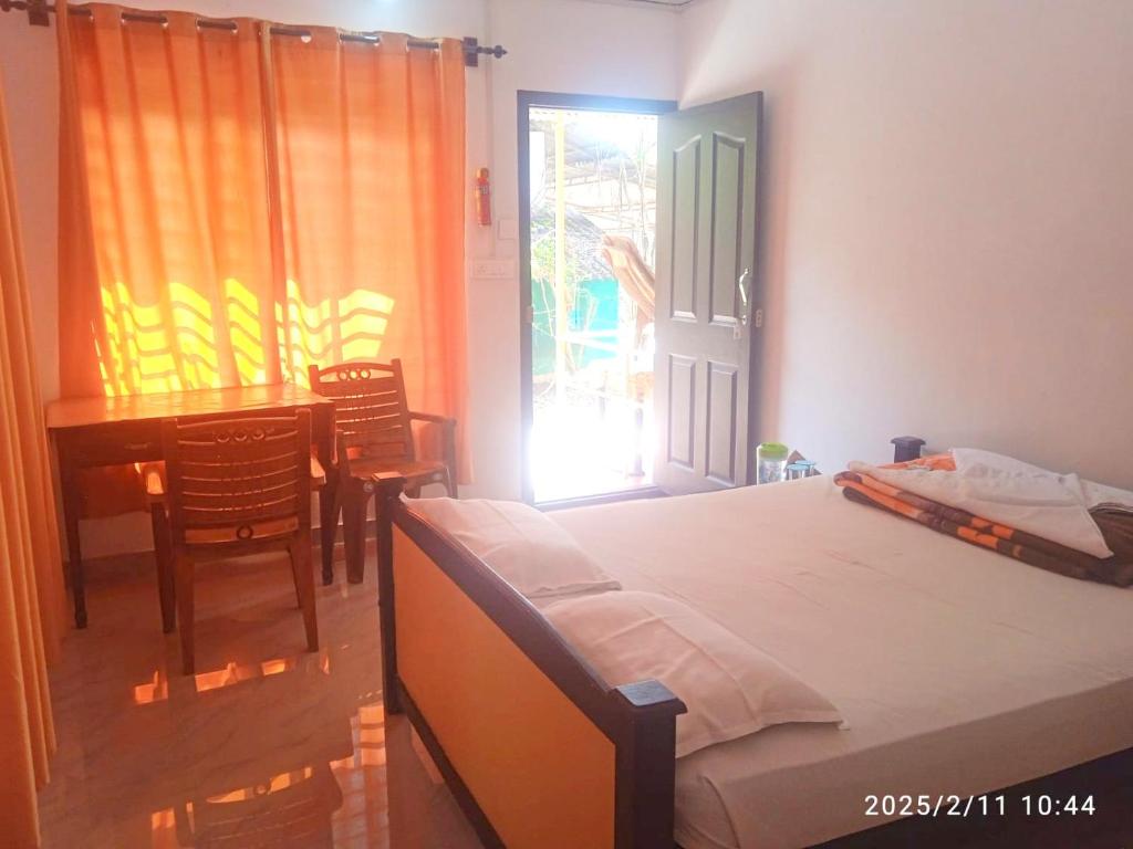 Postel nebo postele na pokoji v ubytování Woodside Homestay Wayanad