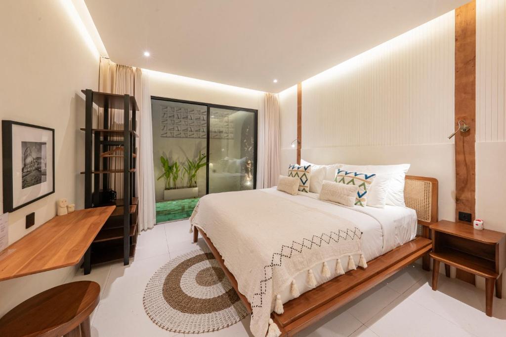Tempat tidur dalam kamar di Sulu Villas - Seminyak
