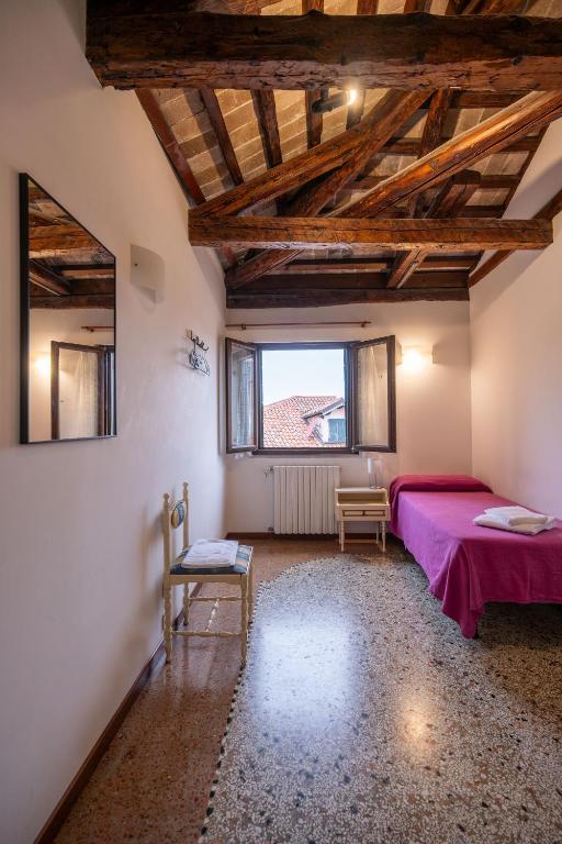 Postel nebo postele na pokoji v ubytování Foresteria Valdese Venezia