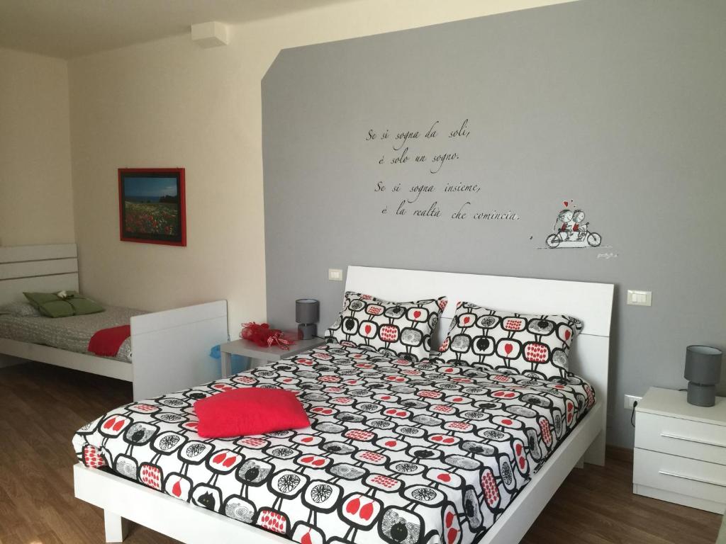 Posteľ alebo postele v izbe v ubytovaní L'Iris B&B