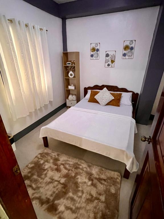 Postel nebo postele na pokoji v ubytování Eighty8 Tourist Inn