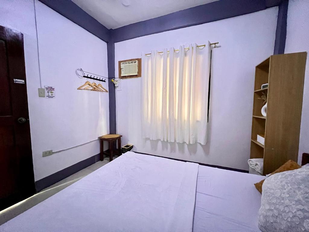 Postel nebo postele na pokoji v ubytování Eighty8 Tourist Inn