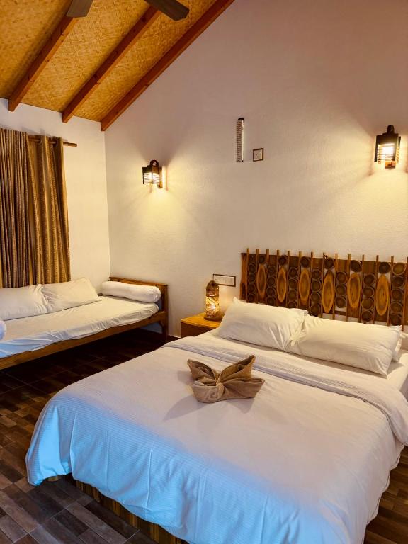 Postel nebo postele na pokoji v ubytování Ameera Maldives