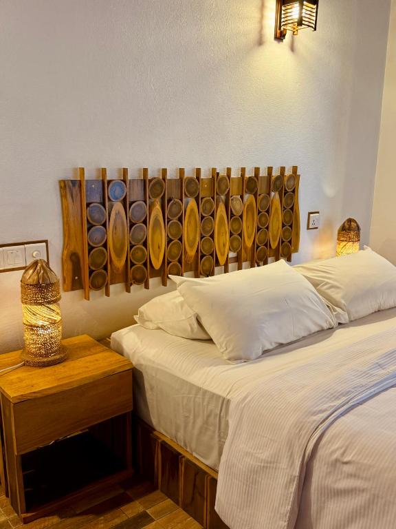 Postel nebo postele na pokoji v ubytování Ameera Maldives