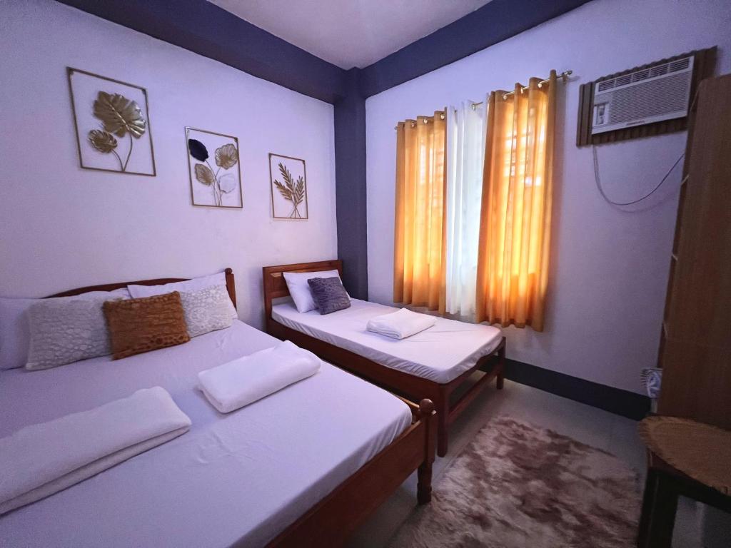 Postel nebo postele na pokoji v ubytování Eighty8 Tourist Inn