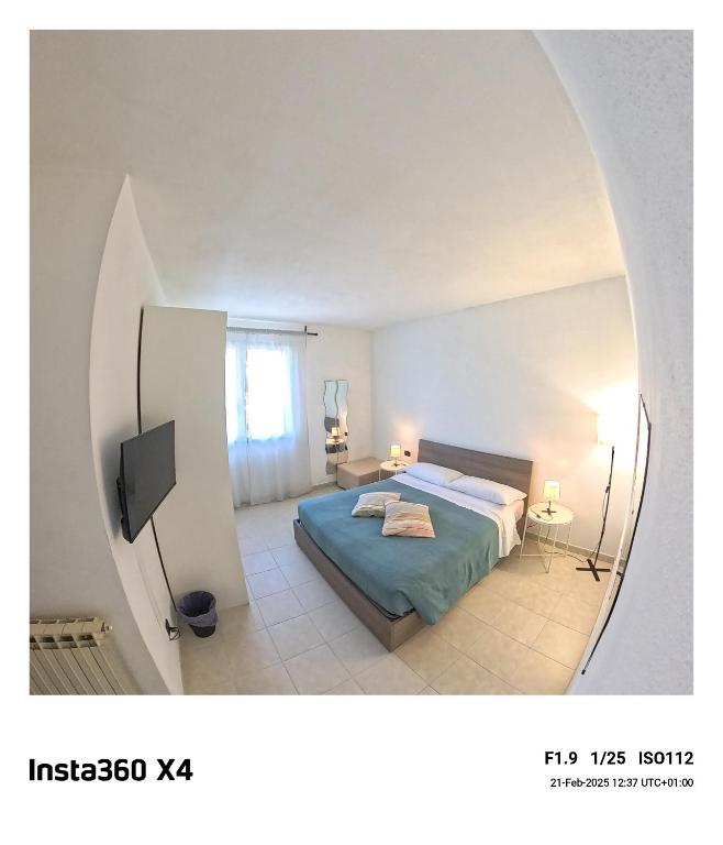 Łóżko lub łóżka w pokoju w obiekcie LA ROSA APP
