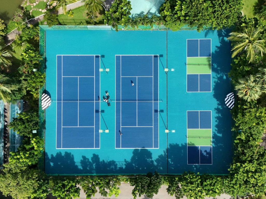 an overhead view of a tennis court with two tennis courts at Pullman Phuket Karon Beach Resort in Karon Beach
