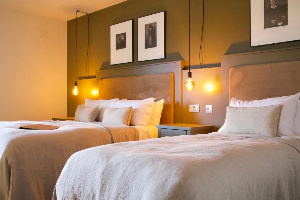 Voodi või voodid majutusasutuse Fiddle + Bow Hotel toas