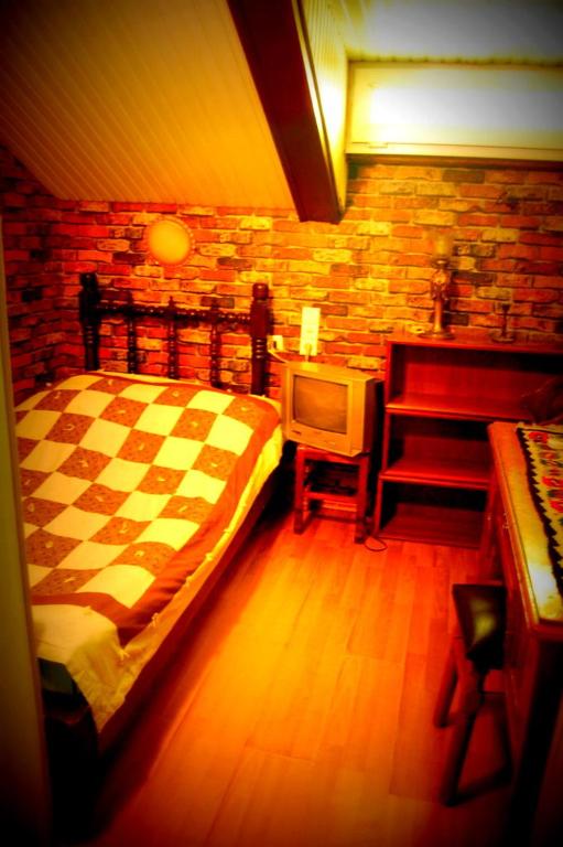 Postel nebo postele na pokoji v ubytování Guest House Irina Tbilisi
