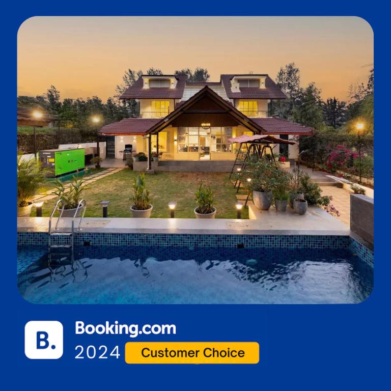 a house with a swimming pool in front of it at EKOSTAY - Shelby Villa in Panchgani