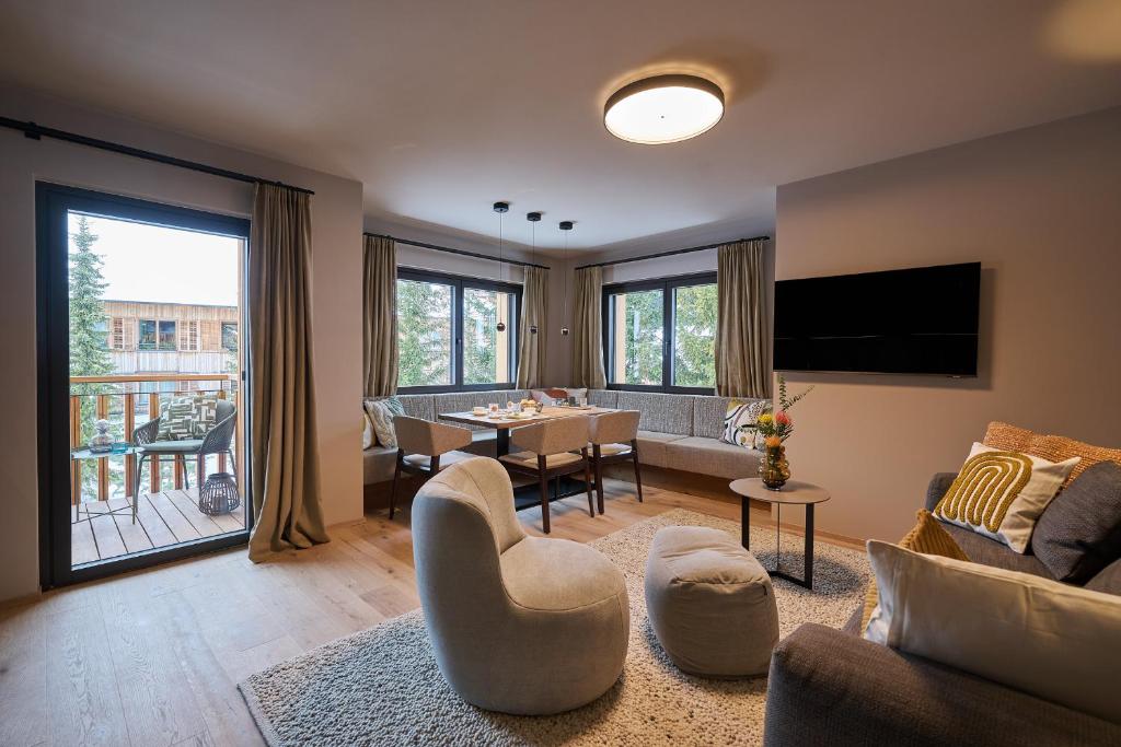 TV a/nebo společenská místnost v ubytování Aparthotel Dorf570