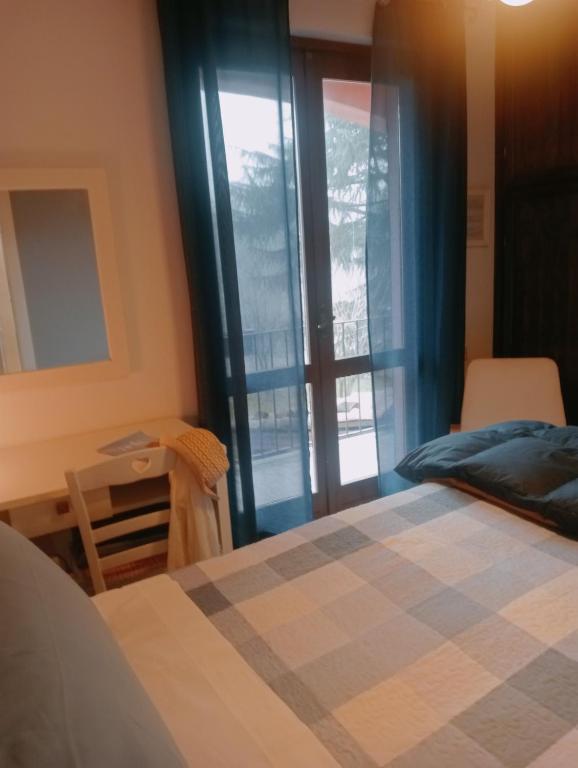Postel nebo postele na pokoji v ubytování B&B Cascina Ciapilau