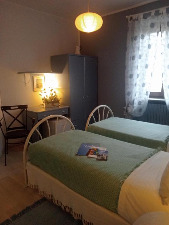 Postel nebo postele na pokoji v ubytování B&B Cascina Ciapilau