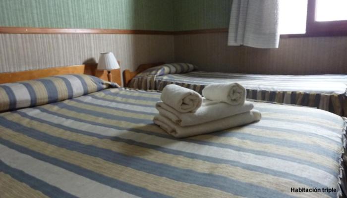 Postel nebo postele na pokoji v ubytování Hotel La Cumbre