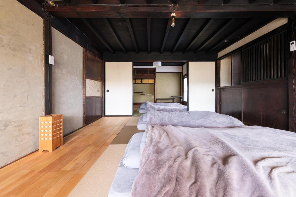 Postel nebo postele na pokoji v ubytování 一棟貸切古民家,信州麹屋の宿,愛犬OK, 平日割,最大9名,Private villa