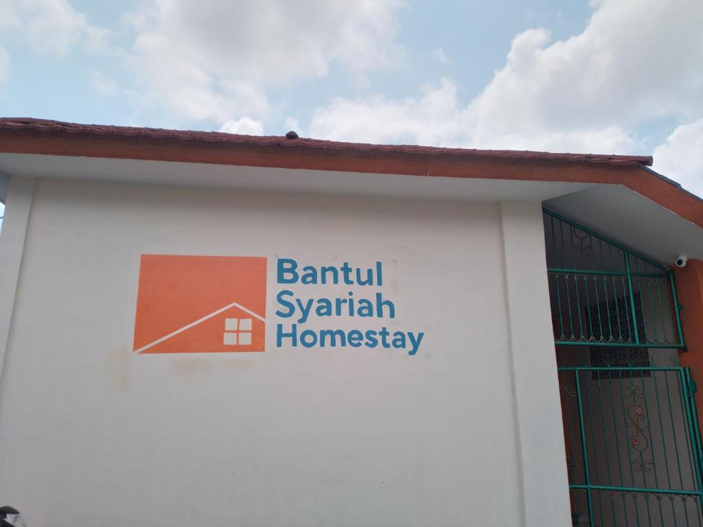 a sign on the side of a building at Bantul Syariah Homestay in Bantul