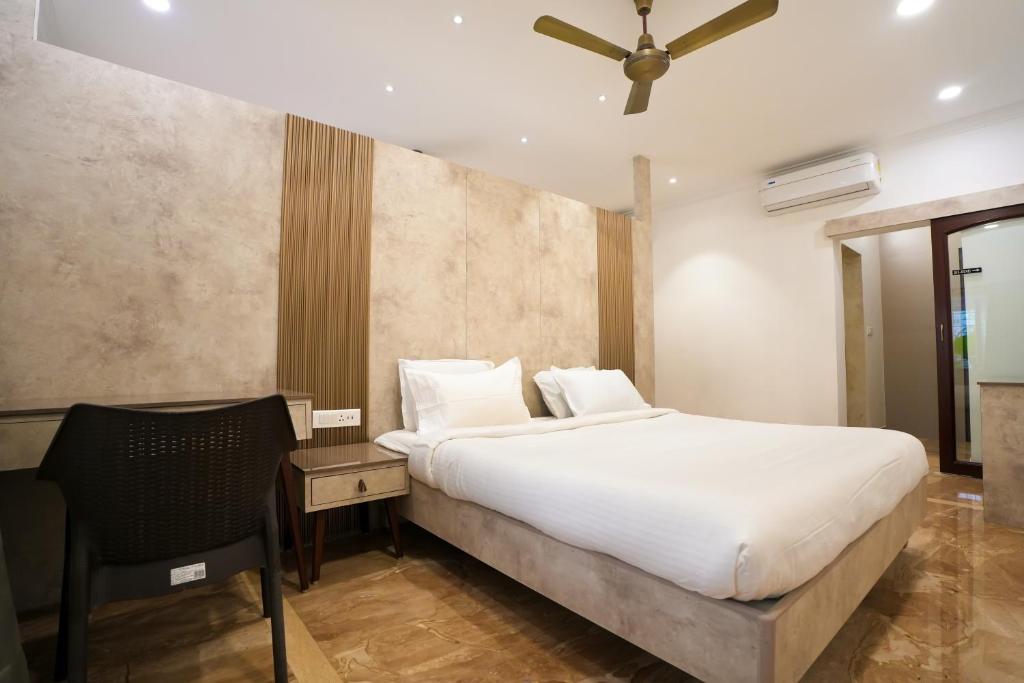 Postel nebo postele na pokoji v ubytování Avenue 11 Boutique Residences, Poes Garden Chennai