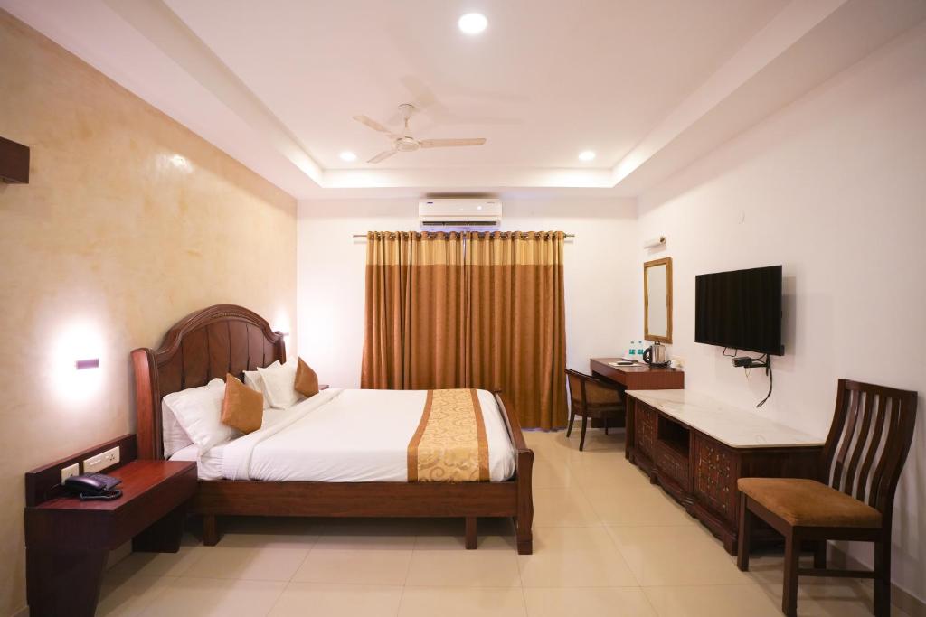 TV a/nebo společenská místnost v ubytování Avenue 11 Boutique Residences, Poes Garden Chennai
