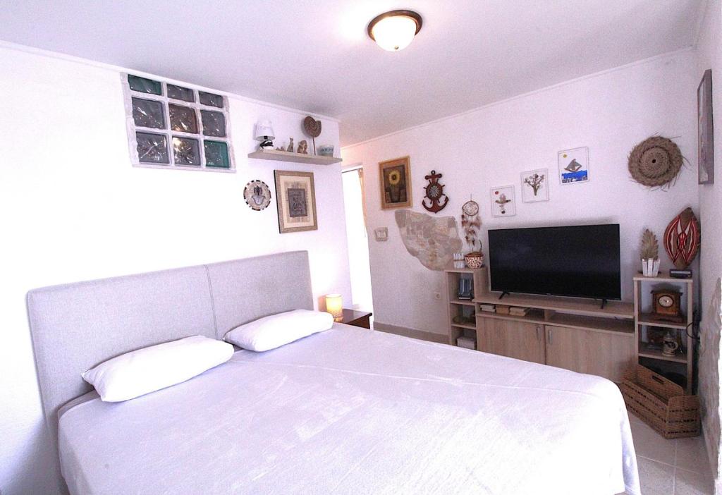 Telewizja i/lub zestaw kina domowego w obiekcie Lovely Apartment ES