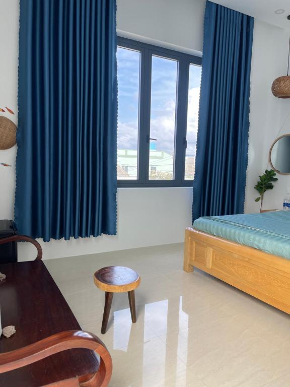 Ένα ή περισσότερα κρεβάτια σε δωμάτιο στο Homestay Minh Hà