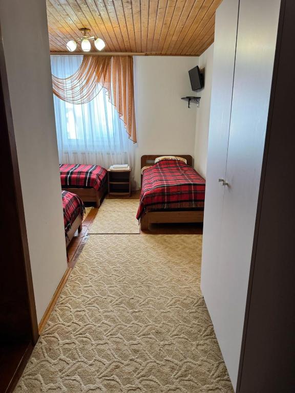 Postel nebo postele na pokoji v ubytování Горизонт