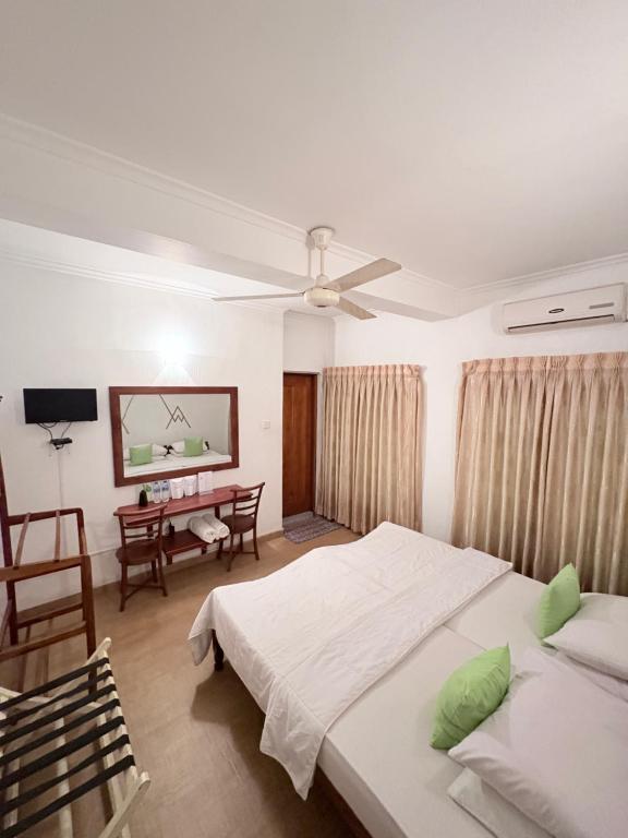Postel nebo postele na pokoji v ubytování Paradise Inn