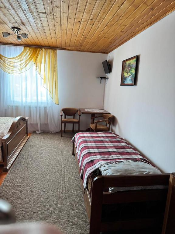 Postel nebo postele na pokoji v ubytování Горизонт