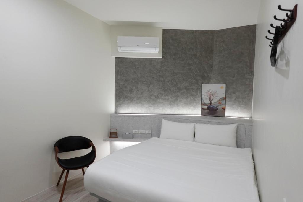 Postel nebo postele na pokoji v ubytování hōo落雨 溫泉旅店