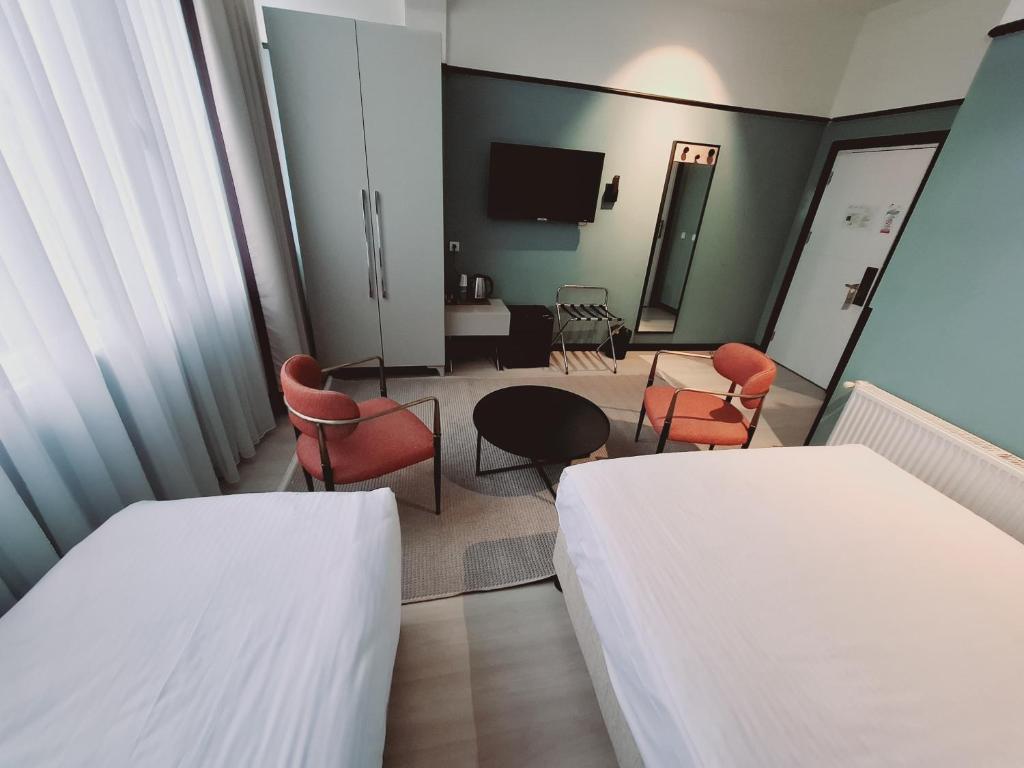A bed or beds in a room at EA Exclusive Hotel