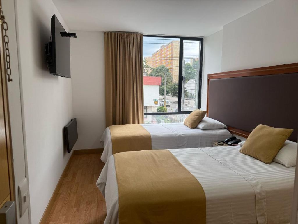 Postel nebo postele na pokoji v ubytování Hotel Dorado Ferial