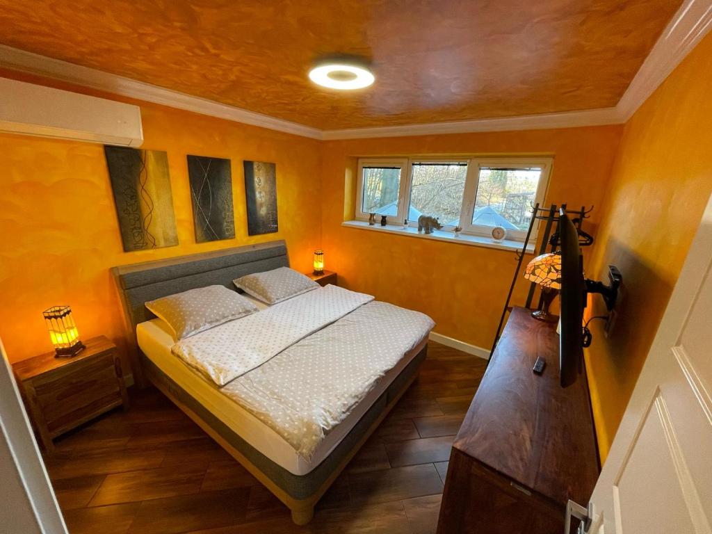 Postel nebo postele na pokoji v ubytování Ostravice Apartment