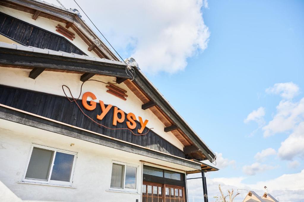 a sign on the side of a building at GYPSY TAKASHIMA in Katsuno