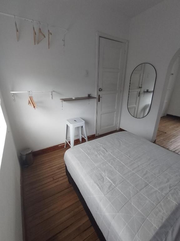 Postel nebo postele na pokoji v ubytování Casa Yolo Bogotá