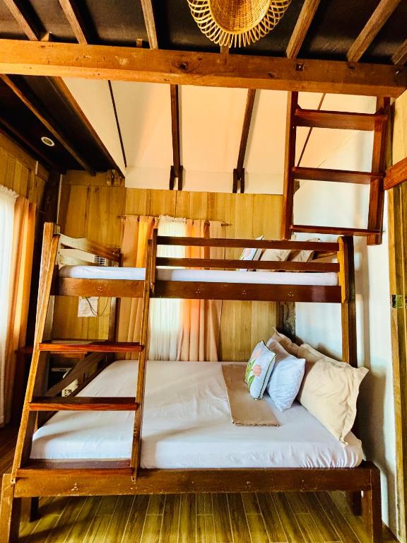 Ένα ή περισσότερα κρεβάτια σε δωμάτιο στο Beachfront Cabin in Lobo