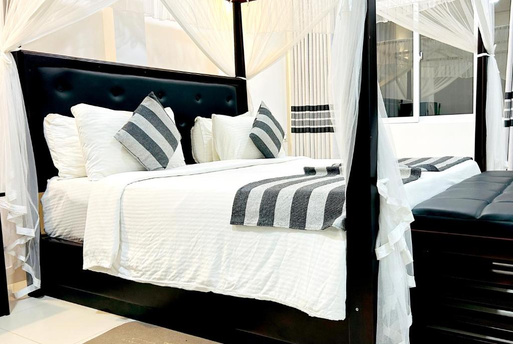 Postel nebo postele na pokoji v ubytování O2 Villas-Weligama