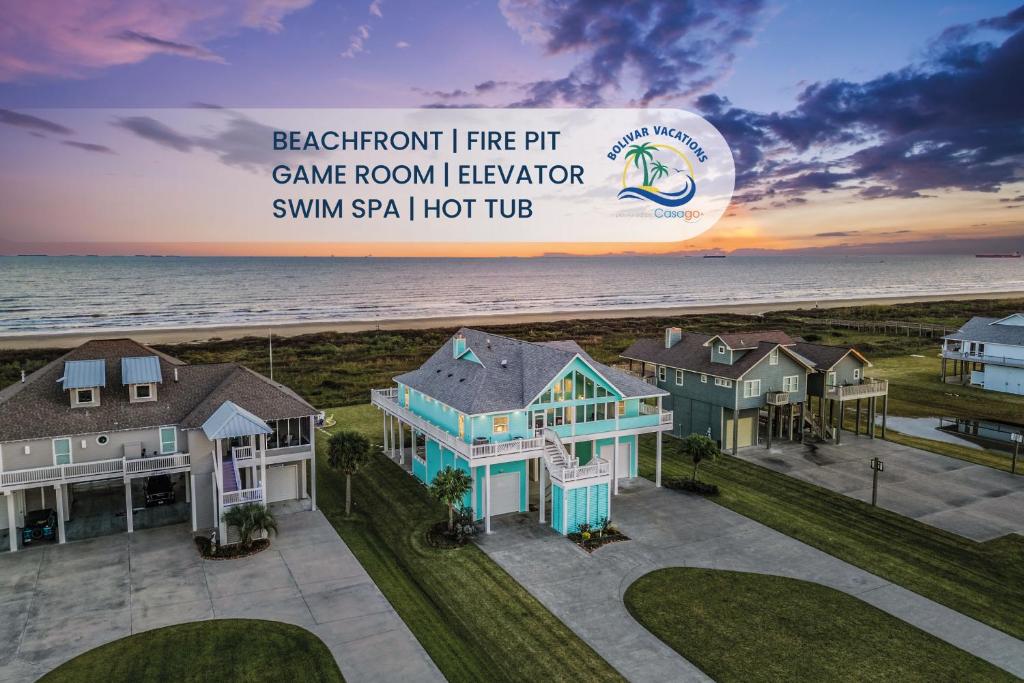 an aerial view of a beachfront fire pit game room lagoon vacationominiumsm at Beachfront Hideaway! Luxury Beachfront, SwimSpa, Game Room, Firepit by Bolivar Vacations in Port Bolivar