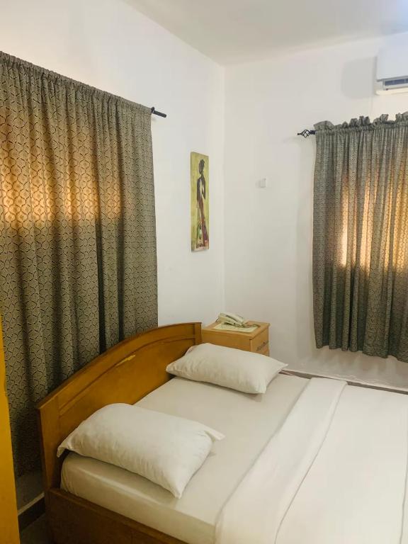 Postel nebo postele na pokoji v ubytování Cozy room Shortlet Apartment in Ikoyi, Lagos