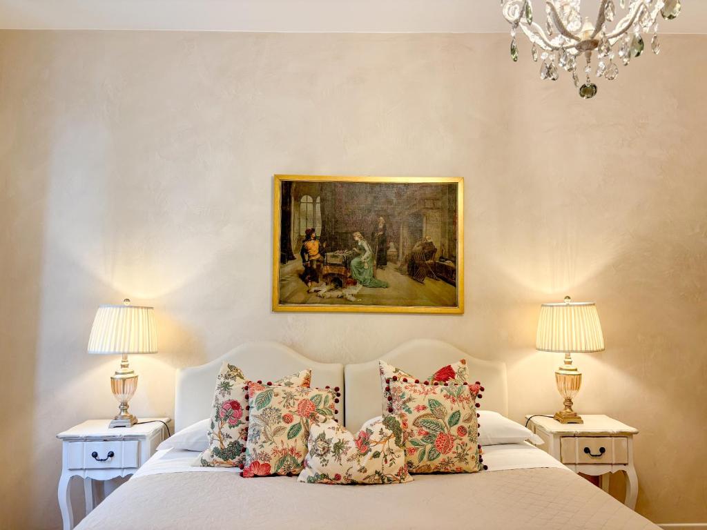 En eller flere senge i et værelse på Palazzo Tiolo