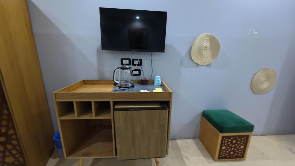 TV a/nebo společenská místnost v ubytování Hostalio Pyramid View