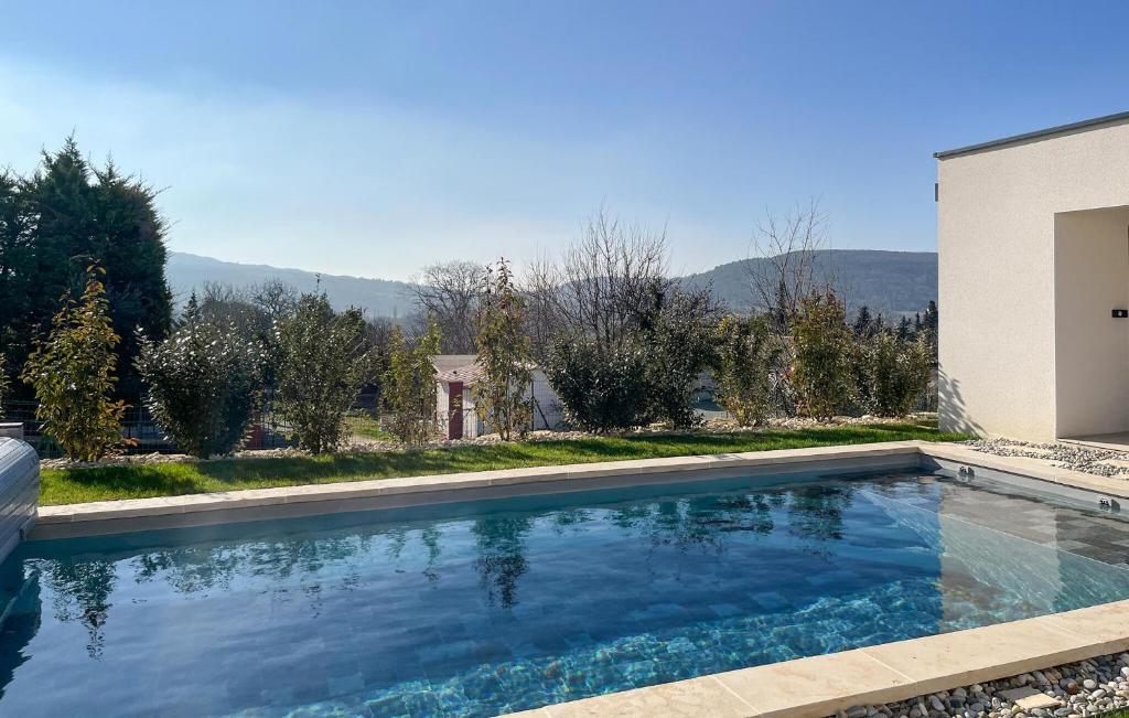 a swimming pool in the backyard of a house at Pet Friendly Home In Valaurie With Wifi in Valaurie
