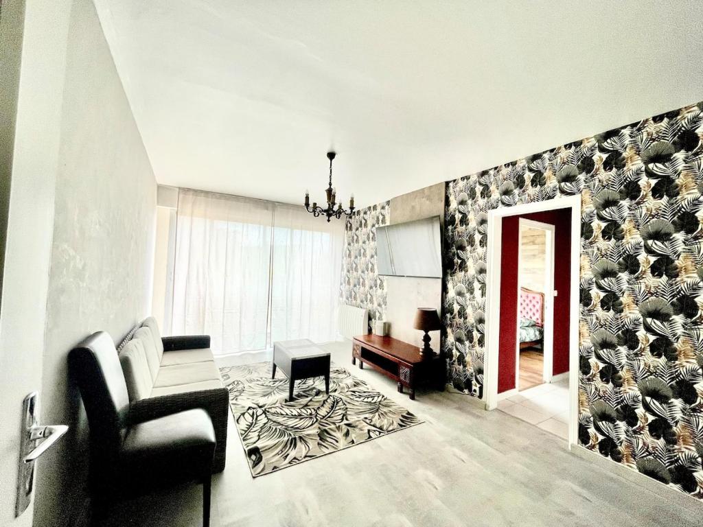 Posezení v ubytování Bel appartement lumineux avec balcon 1 chambre