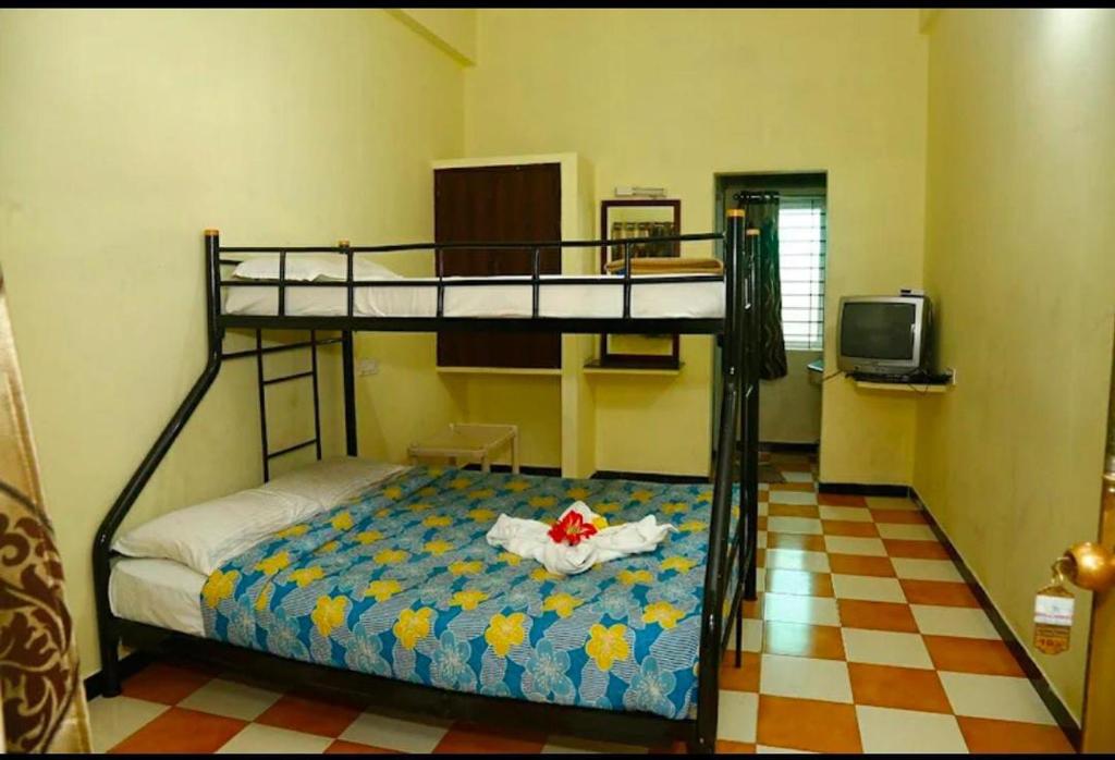 Postel nebo postele na pokoji v ubytování Drizzling Resort