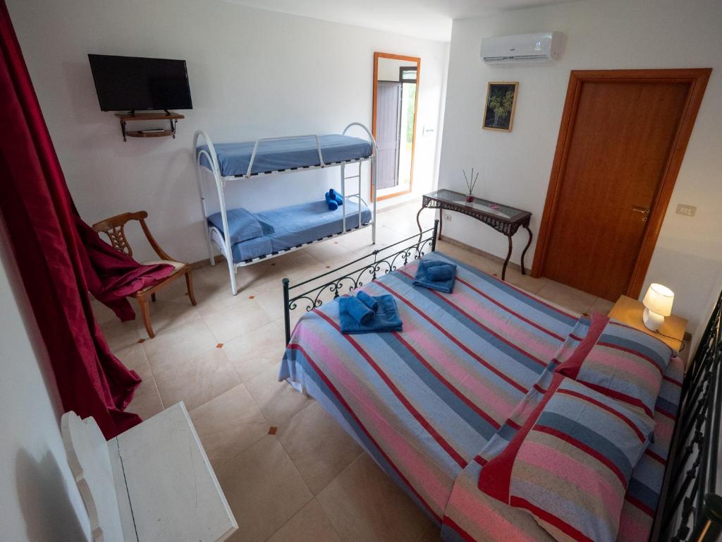 Postel nebo postele na pokoji v ubytování Agriturismo Twin Tails - Sant'Isidoro